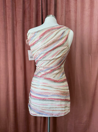 Mannequin wearing a multicolored striped dress against a brown curtain background